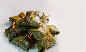 Traditional Nacatamales in banana leaves isolated