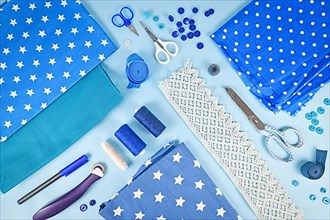 Sewing flat lay with various tools like fabric