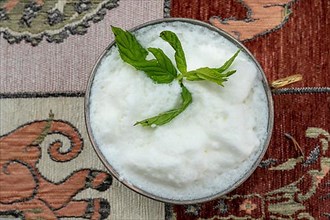 Traditional Turkish drink ayran with mint leaves