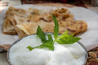 Traditional Turkish meal Gozleme with ayran on the table