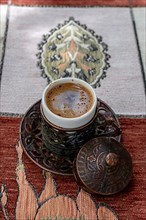 Traditional Turkish coffee on table