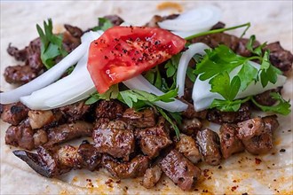 Traditional food of Sanliurfa grilled lamp livers badded with lavash