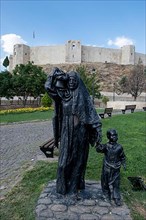 Statue of an Anatolian woman with children in front of Gaziantep Castle
