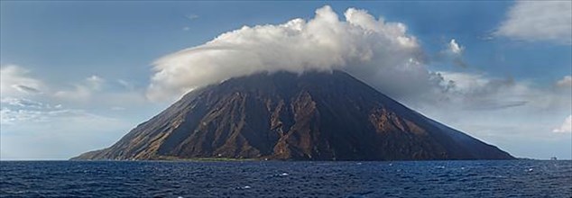 Stromboli volcano and island with bizarre cloudscape