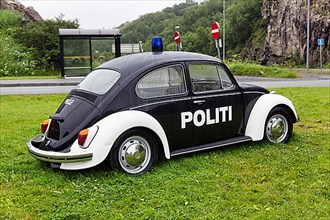 Black and white police patrol car with lettering Politi