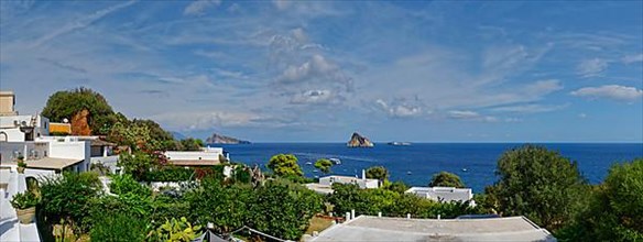 Town of Panarea overlooking the small island of Le Guglie and di Basiluzzo of a former volcano