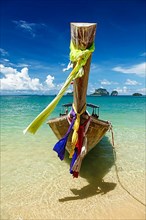 Long tail boat on tropical beach