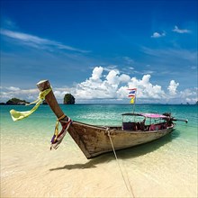 Long tail boat on tropical beach