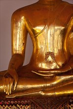 Sitting Buddha statue close up details. Wat Pho temple
