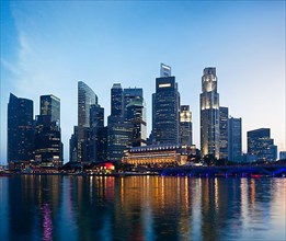 Singapore skyline and Marina Bay in evening