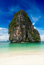 Fantastic idyllic tropical beach with picturesque limestone rock. Thailand