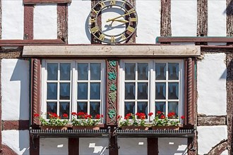 Half-timbered house with clock