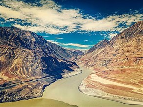 Vintage retro effect filtered hipster style image of confluence of Indus and Zanskar rivers in Himalayas. Indus valley