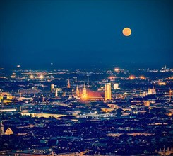 Vintage retro hipster style travel image of night aerial view of Munich from Olympiaturm