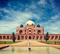 Vintage retro hipster style travel image of Humayun's Tomb with overlaid grunge texture. Delhi