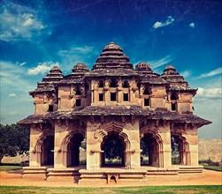 Vintage retro hipster style travel image of Lotus Mahal ruins with overlaid grunge texture. Royal Centre. Hampi