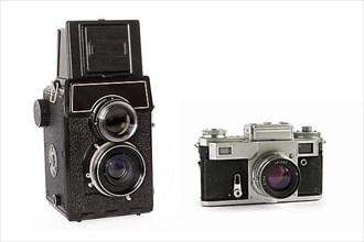 Old rangefinder and twin-lens reflex large format film cameras isolated on white background