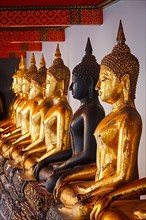 Sitting Buddha statues in Buddhist temple Wat Pho