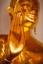 Buddha golden statue blessing hand