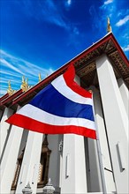 Thailand flag and Buddhist temple Wat Pho. Bangkok