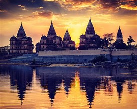 Vintage retro effect filtered hipster style image of Royal cenotaphs of Orchha over Betwa river. Orchha