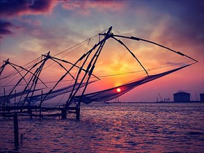 Vintage retro effect filtered hipster style image of Kochi chinese fishnets on sunset. Fort Kochin