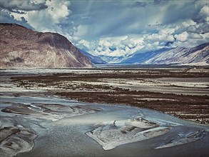 Vintage retro effect filtered hipster style image of Nubra valley and Nubra river in Himalayas. Ladakh