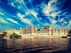 Vintage retro effect filtered hipster style image of City Palace view from the lake. Udaipur