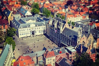 Vintage retro hipster style travel image of aerial view of the Burg square with the City Hall. Bruges