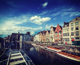 Vintage retro hipster style travel image of travel Belgium medieval european city town background with canal. Koperlei street