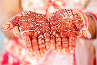 Beautiful henna design on hand of Hindu bride