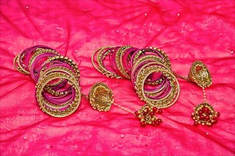 Closeup of Hindu brides bangles on red