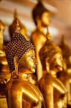 Golden Buddha statues in buddhist temple Wat Saket