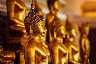 Golden Buddha statues in buddhist temple Wat Saket