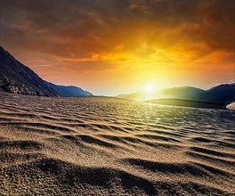 Sand dunes in Himalayas on sunrise. Hunder