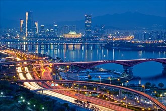Aerial view of Seoul downtown cityscape and Seongsan bridge over Han River in twilight. Seoul