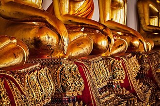 Sitting Buddha statues close up details. Wat Pho temple