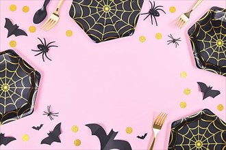 Halloween party frame with black and gold spider web plates