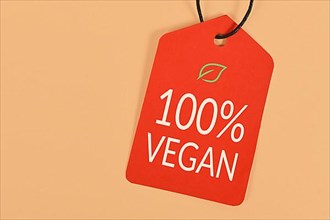 Red label with text '100% Vegan'