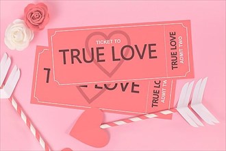 Valentines day concept with True Love ticket and cupid arrows on pink background