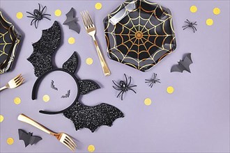 Halloween party flat lay with spider web plates