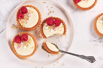 Small tartlet pastries with white cream