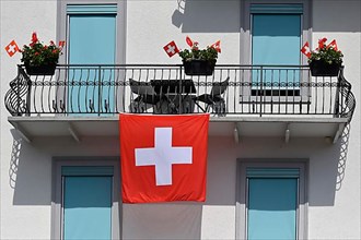 House flagging Swiss flag