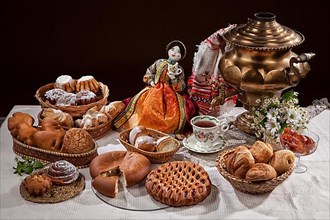 Still life with different kinds of bread on a tablecloth
