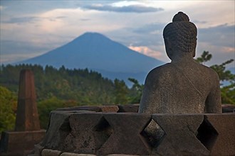 Buddha statue overlooking the volcano at Borobudur
