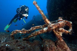 Diver and old anchor