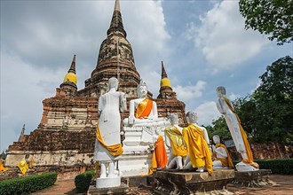 Buddha statues in front of the stupa in Wat Yai Chai Mongkhon