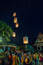 Releasing sky lanterns during the Festival of Lights