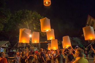 Releasing sky lanterns during the Festival of Lights