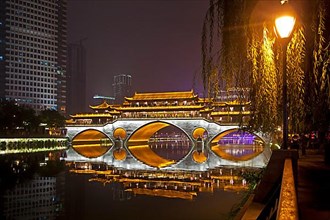 Illuminated Anshun Bridge over the Jin River at night in the provincial capital Chengdu